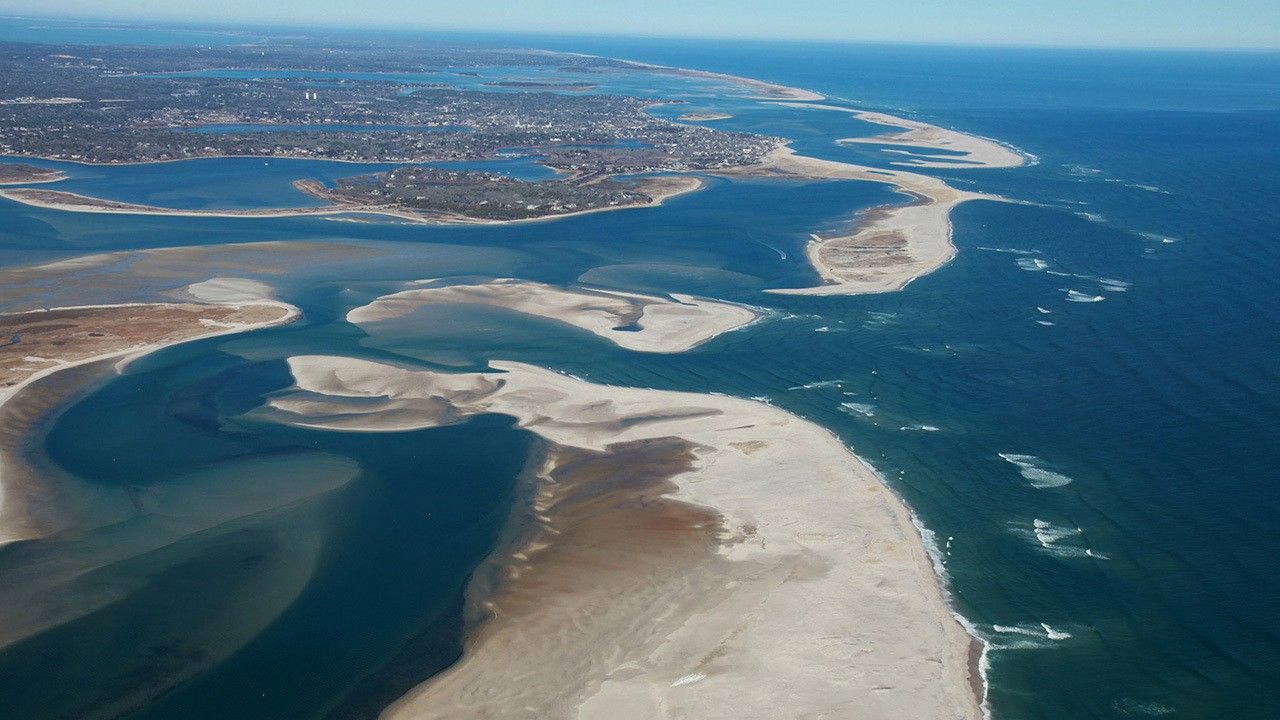 Sandbars surrounded by ocean.