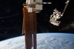 The EMIT instrument attached to the International Space Station with a dotted red circle around it