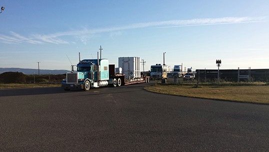 A truck convoy carrying NASA's Orbiting Carbon Observatory-2 spacecraft arrives at California's Vandenberg Air Force Base April 30. The observatory will undergo final tests and then be integrated atop a United Launch Alliance Delta II rocket in preparation for a planned July 1 launch. Credit: NASA/JPL-CaltechView large image.