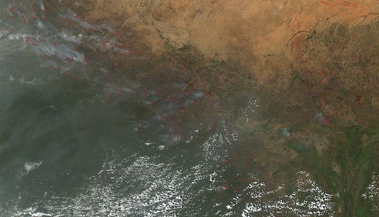 The Moderate Resolution Imaging Spectrometer (MODIS) instrument on NASA's Aqua satellite captured this image of numerous fires burning in the transition zone between the Sahara Desert to the north and the greener savannas to the south. The image, dating from November 2004, includes parts of Sudan, Chad and other nations to the south and west. Credit: NASA. View larger image.