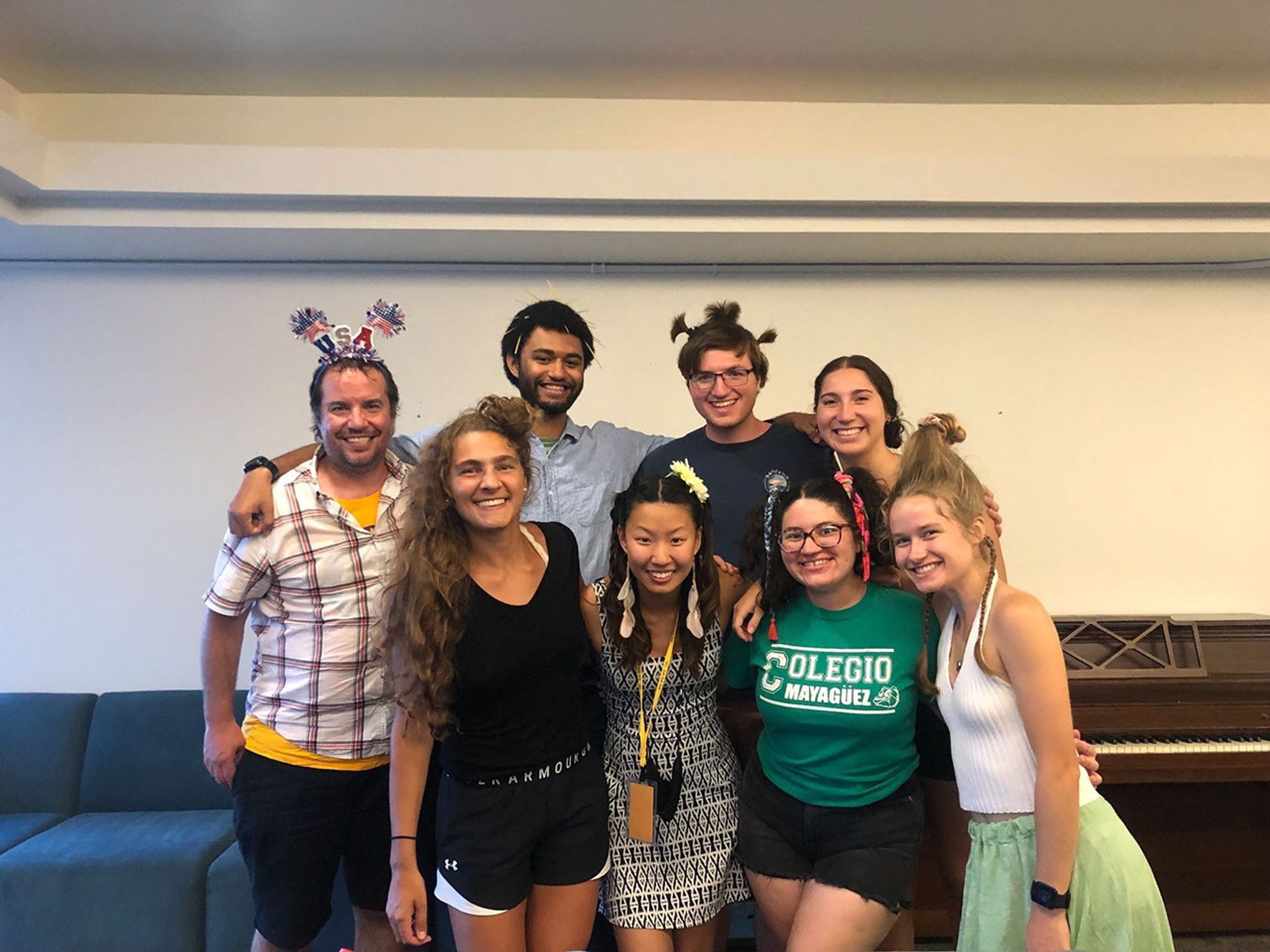 8 Students posing for a photo with silly hair decorations