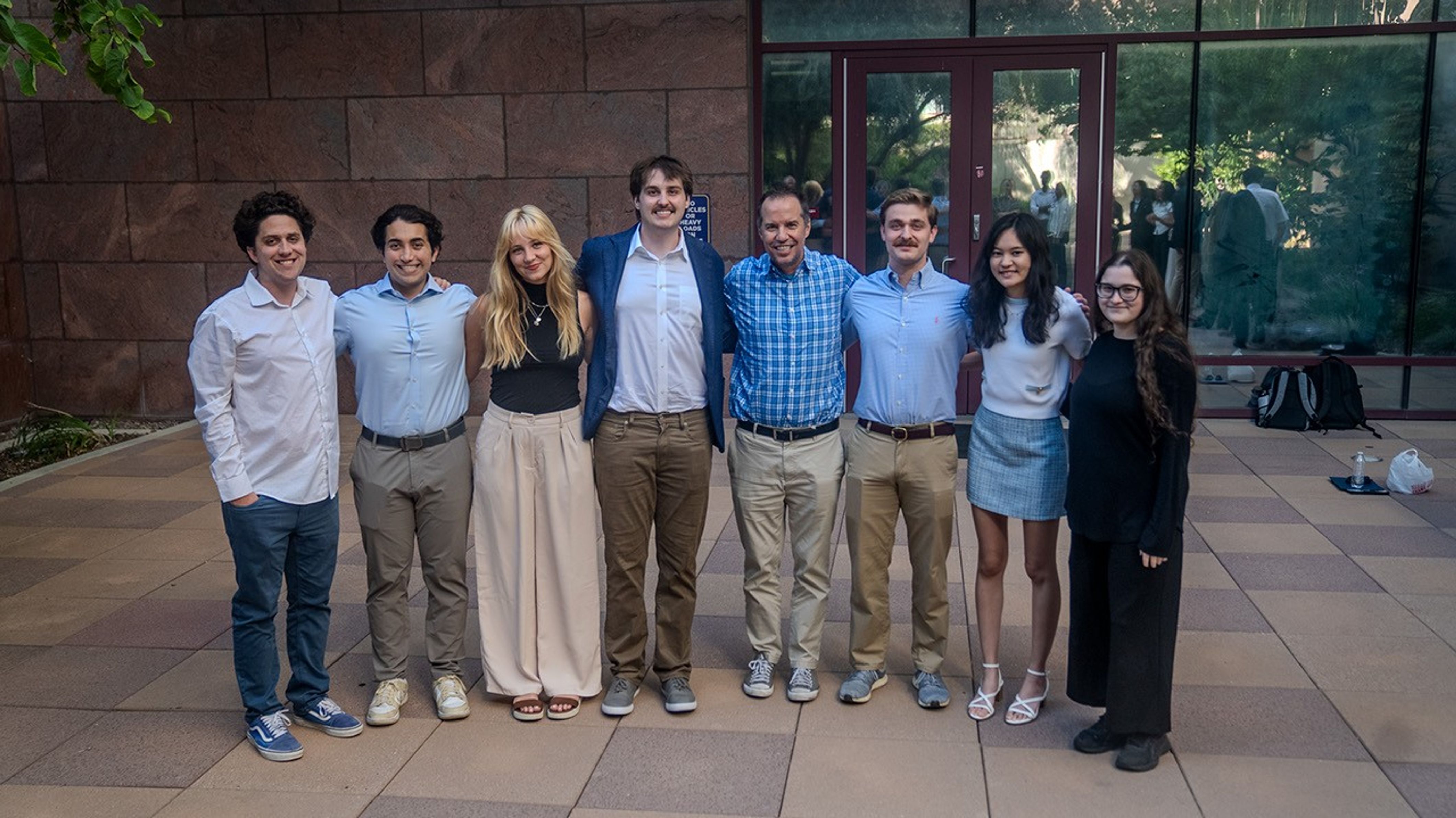 SARP students standing together, eight people total, posing for a photo.