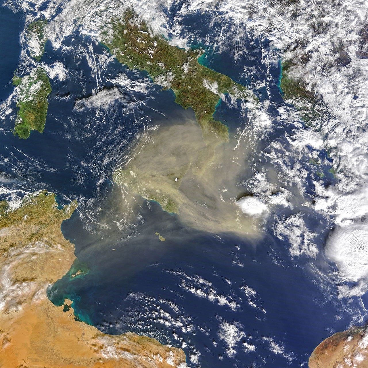 Mount Etna Stands Above the Dust