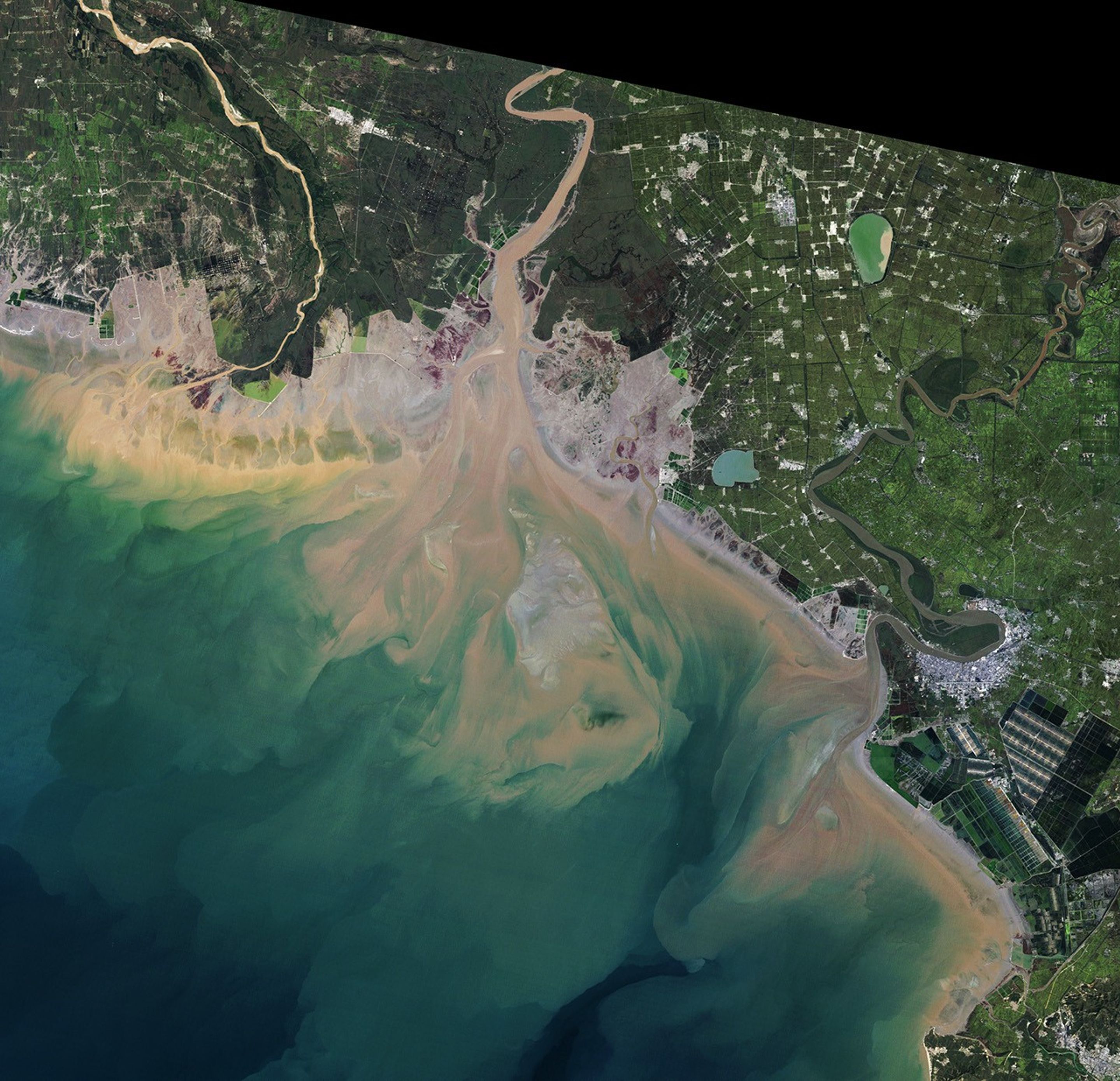 A Changing Estuary Lined With Red