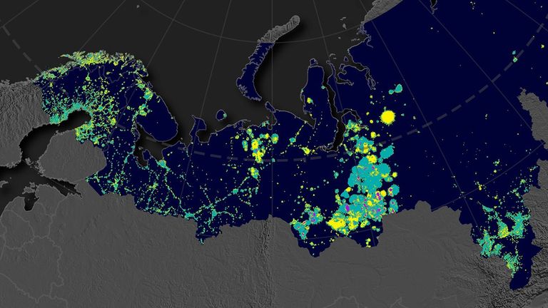 This map shows a pan-Arctic view of nighttime lights and places where the intensity of artificial lights has increased (yellow), decreased (purple), or stayed the same (green).