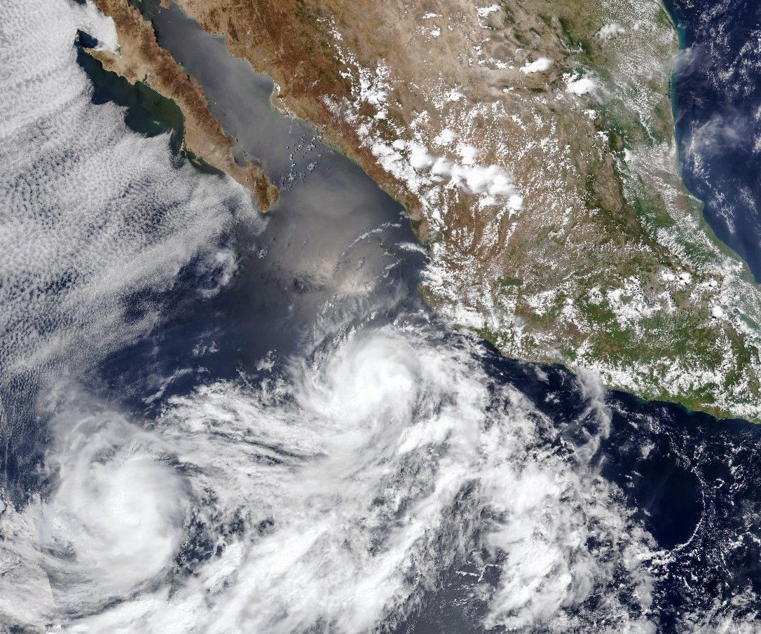 Storm Duo Churns Over the Pacific