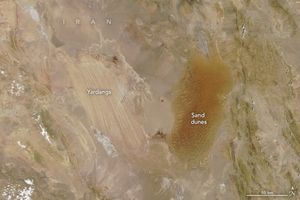 Lines across the beige landscape are labelled Yardangs. To the right of those are a darker shade of earth, near orange, labeled Sand dunes.