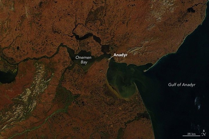 Rust red dominates the landscape, disrupted by a river and Onemen Bay just left of center in the image. Anadyr is labeled at the tip of the peninsula between the bay and Gulf of Anadyr at the right edge of the image. The water is near black in color.