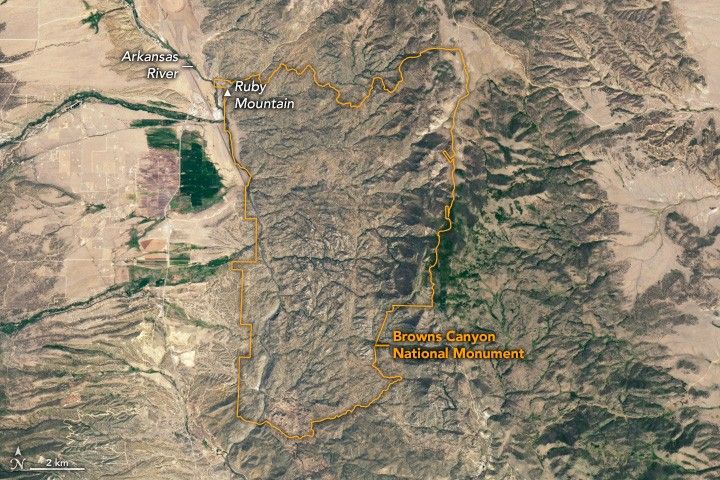 An orange outline frames in Browns Canyon National Monument which encompasses craggy dark brown landscape. Ruby Mountain is labeled in the upper left corner of the monument, and Arkansas river meets the border in that same area.