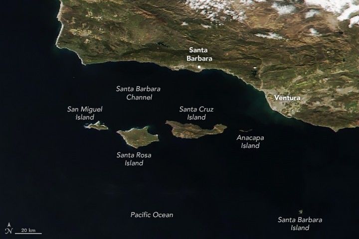 Major landmass, including the cities of Santa Barbara and Ventura, occupy the center top of the image to the center right of the image. Four islands reside off the coast and separate the Santa Barbara Channel from the Pacific Ocean. From right to left the islands are San Miguel, Santa Rosa, Santa Cruz (the largest) and Anacapa (the smallest) islands. Santa Barbara island is another very small island, comparatively distant from the other four, in the bottom right corner of the image.