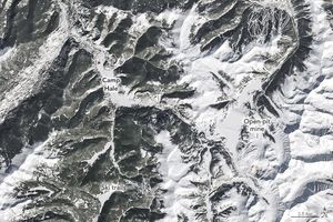 The image shows snow covered mountainous landscape with the land more gray slopes than white blankets of snow. An open pit mine is labeled in the lower right section of the image, and Camp Hale is labeled just left of center at the peak of a ridgeline. Camp Hale has a broad degree of snow coverage compared to the remaining left side of the image. Ski trails are labeled in the lower middle of the image.