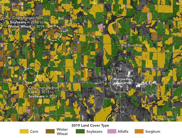 An image of cropland surrounding Marysville, just below and right of center, show fields color coded according to what crop is planted. A green field, indicating soybean, is highlighted as a crop change from 2018 to 2019 in the lower left. Up and right from there is an orange field, indicating winter wheat, is another crop rotation highlight