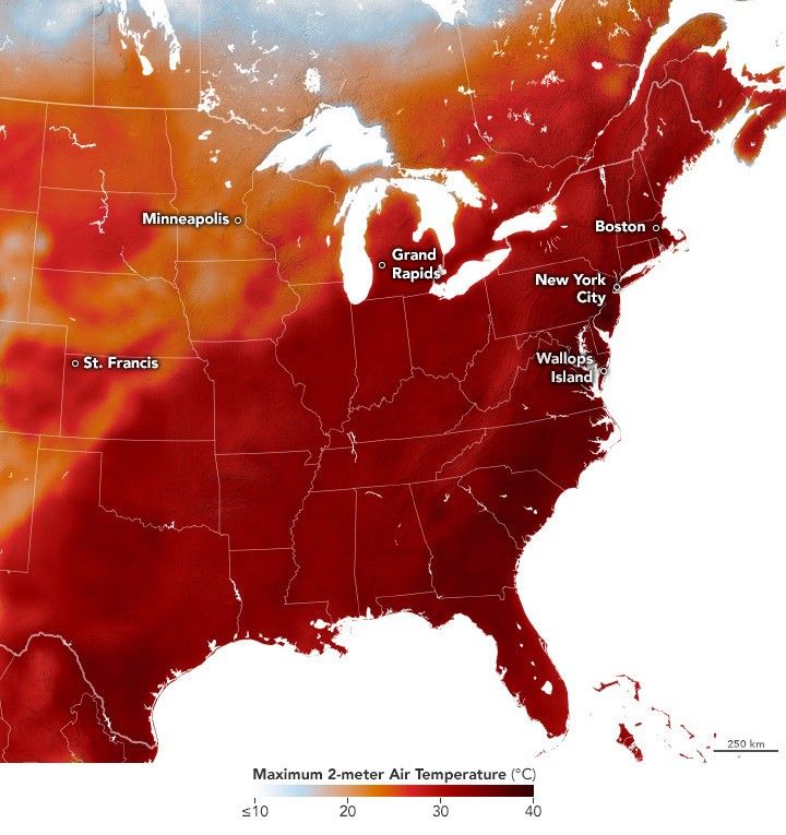 A map of the Eastern half of the united states with state boundaries overlaid in white and a red to white color gradient overlay corresponding to air temperature. The hottest temperature is a near black dark red, at 40 degrees Celsius. The coolest temperature on the scale is white corresponds to 10 degrees Celsius or less. The only area not in the red shade of the spectrum of 20 degrees of higher is in Canada. From Maine to Texas, the entire landscape is a deep red color.