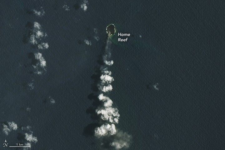 A small island, labeled home reef, is the origin of a thin translucent smoke stream that becomes puffy clouds as it streams toward the bottom of the image.