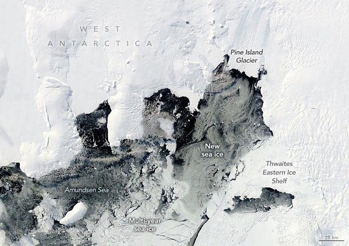 West Antarctica's blanket of white ice occupies the majority of the image. The center to lower left is a mix of the Amundsen Sea water and various types of sea ice. The Thwaites Eastern Ice Shelf is labeled in the lower right, bordering Multi-year sea ice and new sea ice, a darker color of ice by comparison. The Pine Island Glacier is in the upper center right and terminates at the Amundsen Sea as well.