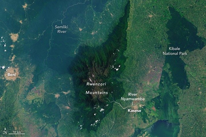 The Rwenzori Mountains stand more than 5,000 meters (16,000 feet) above sea level in eastern Africa. The prominence is visible for miles around and even from orbit, provided it is not hidden by clouds and mist.