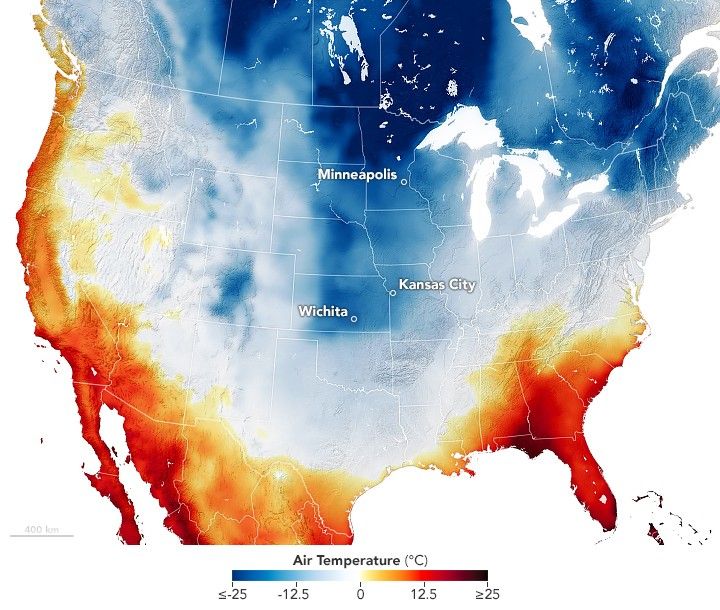 A picture of the United States with state and national borders superimposed. There is also an air temperature gradient superimposed on the map ranging from negative 25 degrees C to 25 degrees C. The color gradient goes from dark blue to white at 0 and then to dark red where blue is cold and red is hot. The Midwest is medium to dark blue and aside from the west coast and coastal southern states the majority of the United States is in the white color temperature region.