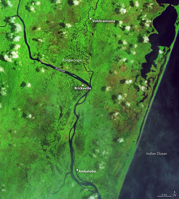 In this false-color image acquired before the flooding, the Rianila and Rongaronga rivers merge near the town of Brickaville. River water appears dark blue against a bright green background of farmland and savanna forest.