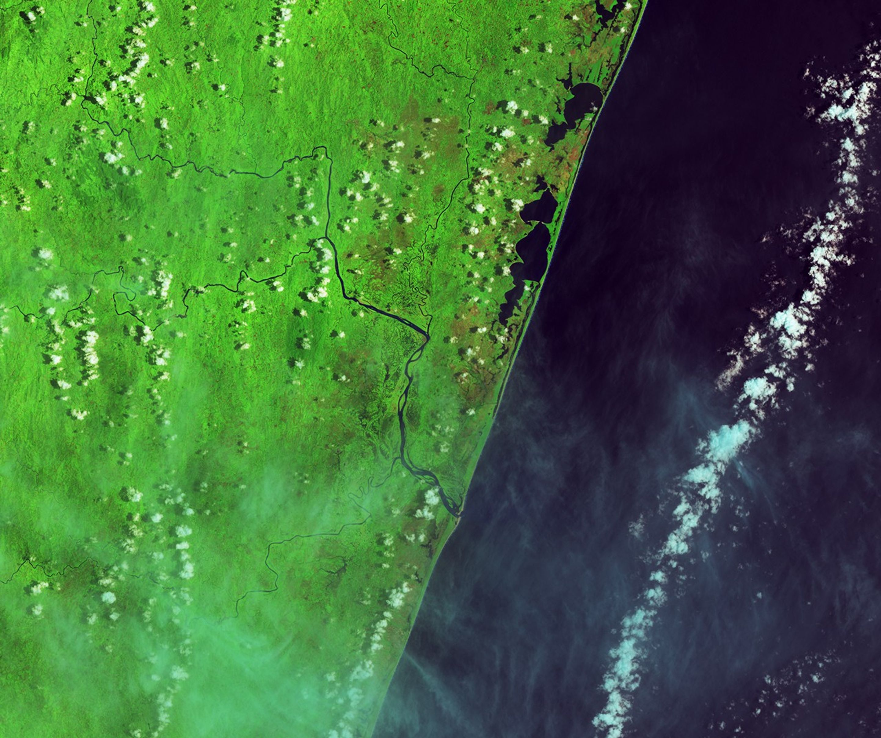 In this false-color image acquired before the flooding, the Rianila and Rongaronga rivers merge near the town of Brickaville. River water appears dark blue against a bright green background of farmland and savanna forest.