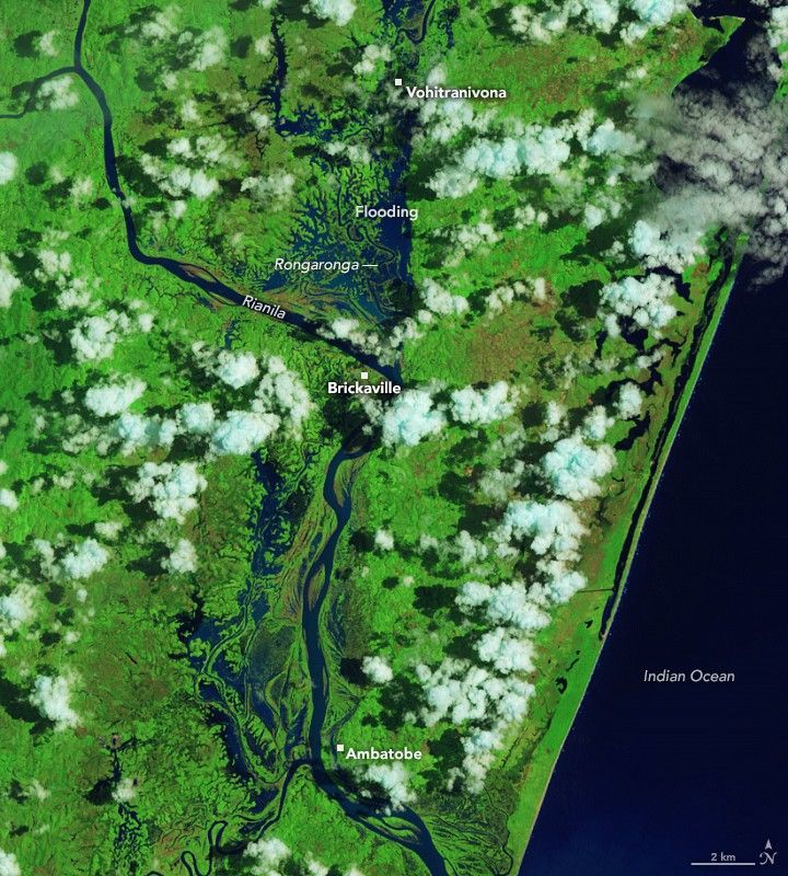 In a false-color image acquired after the flooding, waterways appear much wider, and floodwater covers large portions of the landscape west of the two rivers, both north and south of Brickaville.