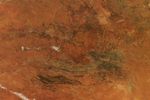 Central Australia’s desert landscape appears predominantly rusty red.