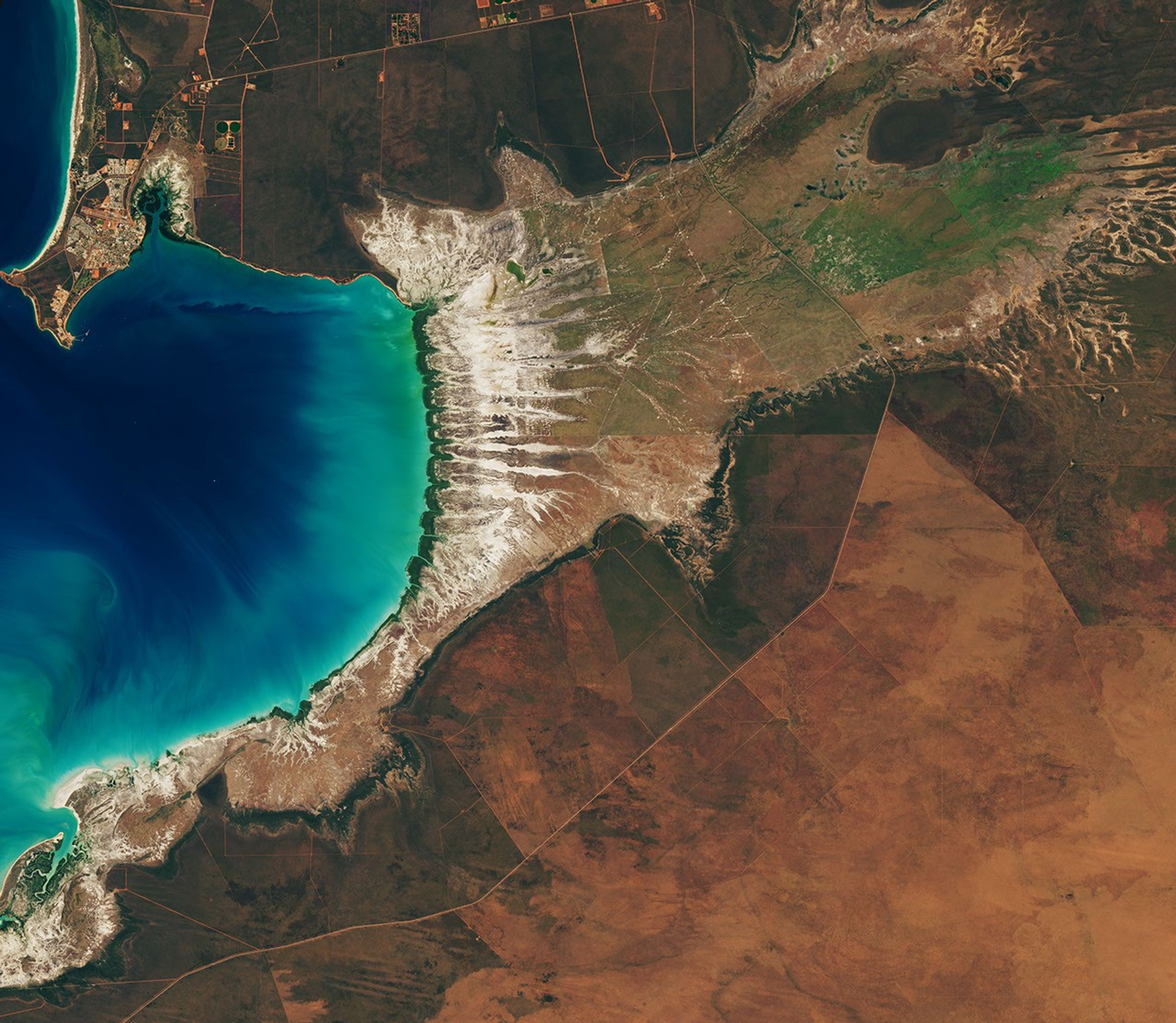 Tidal and seasonal shifts leave their mark on this crescent-shaped, productive bay in Western Australia's Kimberley region.