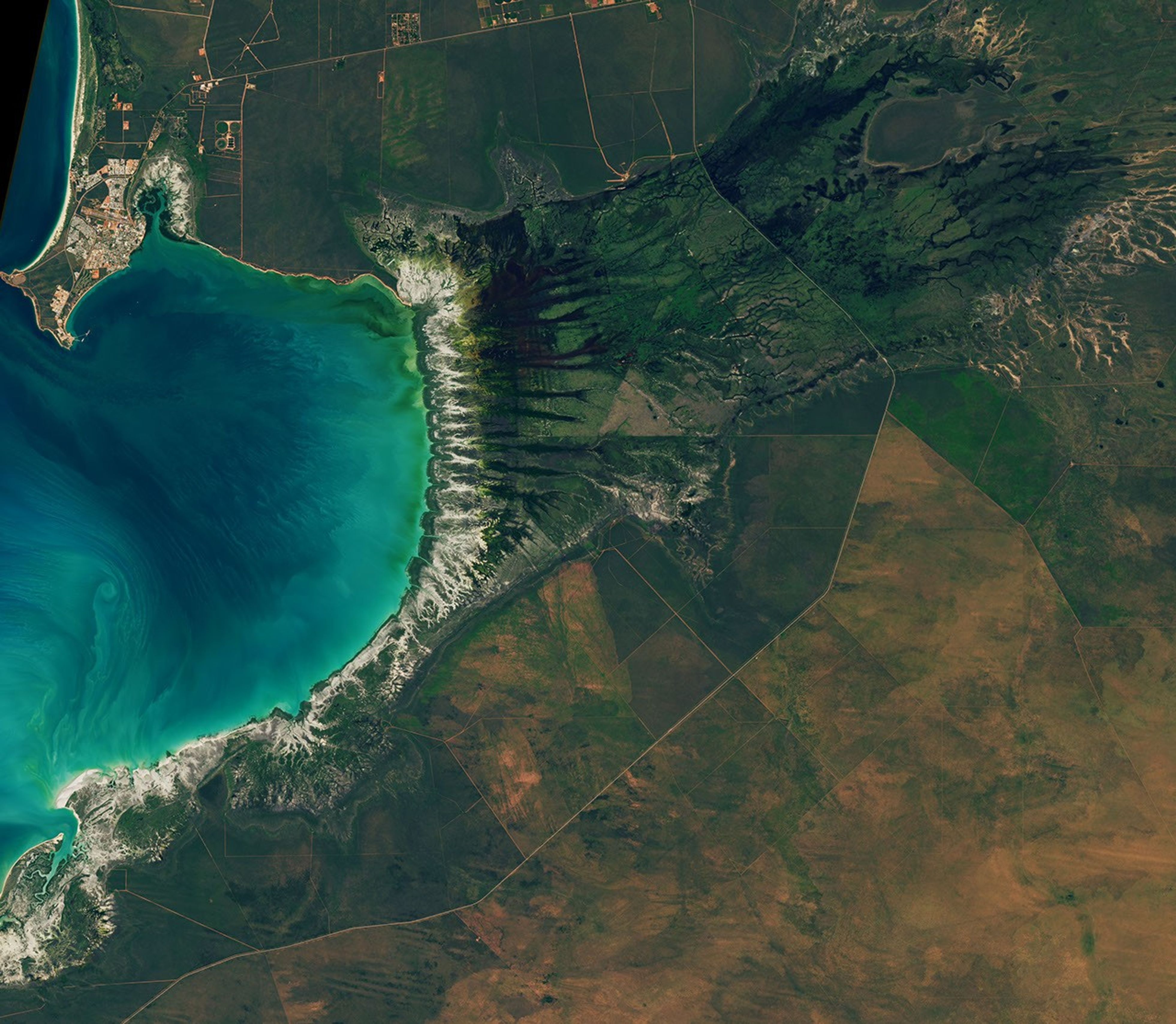 Tidal and seasonal shifts leave their mark on this crescent-shaped, productive bay in Western Australia's Kimberley region.