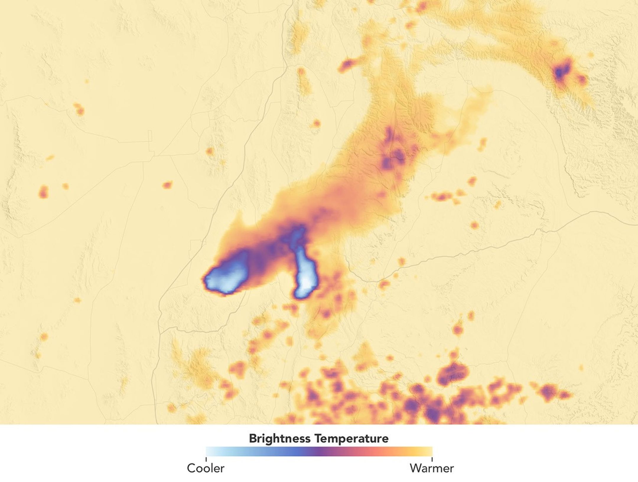 A data visualization shows the cloud-top brightness temperature of the same scene. Tall, cold smoky clouds appear white, and warmer plumes at lower heights appear purple.