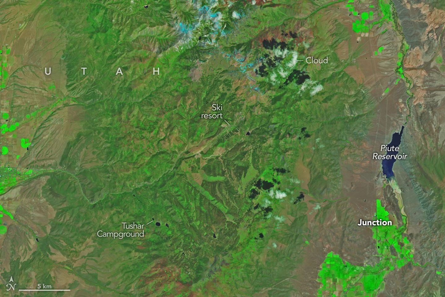 Mountainous landscapes appear green and untouched by fire in a satellite image acquired on June 5, 2026.