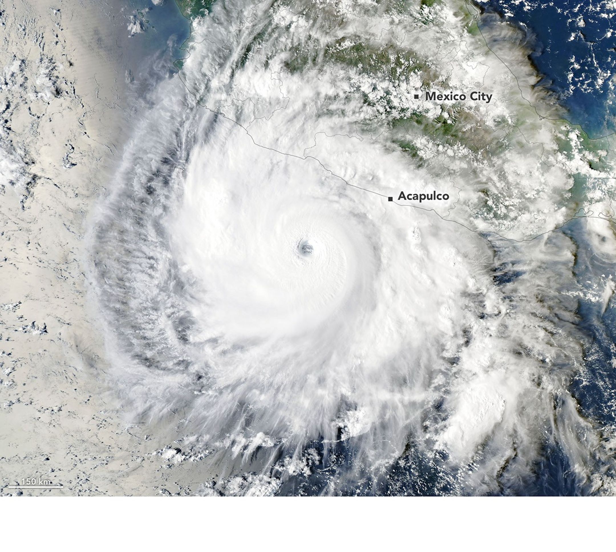 Hurricane Polo, with a well-defined eye, swirls over the Pacific Ocean off the coast of Mexico. The storm was positioned just south of Acapulco, with its outer cloud bands extending inland toward Mexico City.