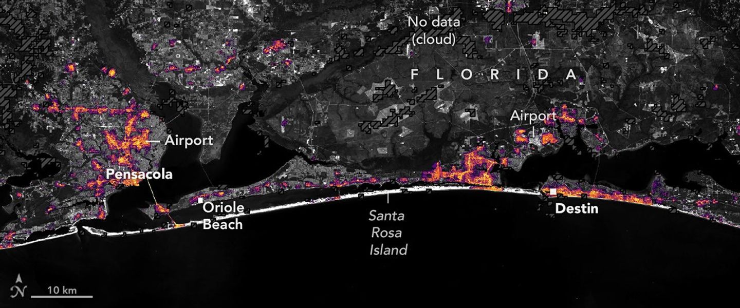The same area on October 12, 2026, with lights in Pensacola and Destin and along the road between them closer to pre-storm levels.