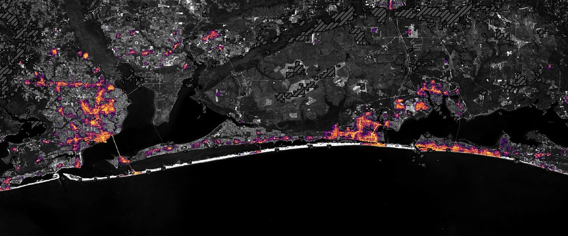 The same area on October 12, 2026, with lights in Pensacola and Destin and along the road between them closer to pre-storm levels.