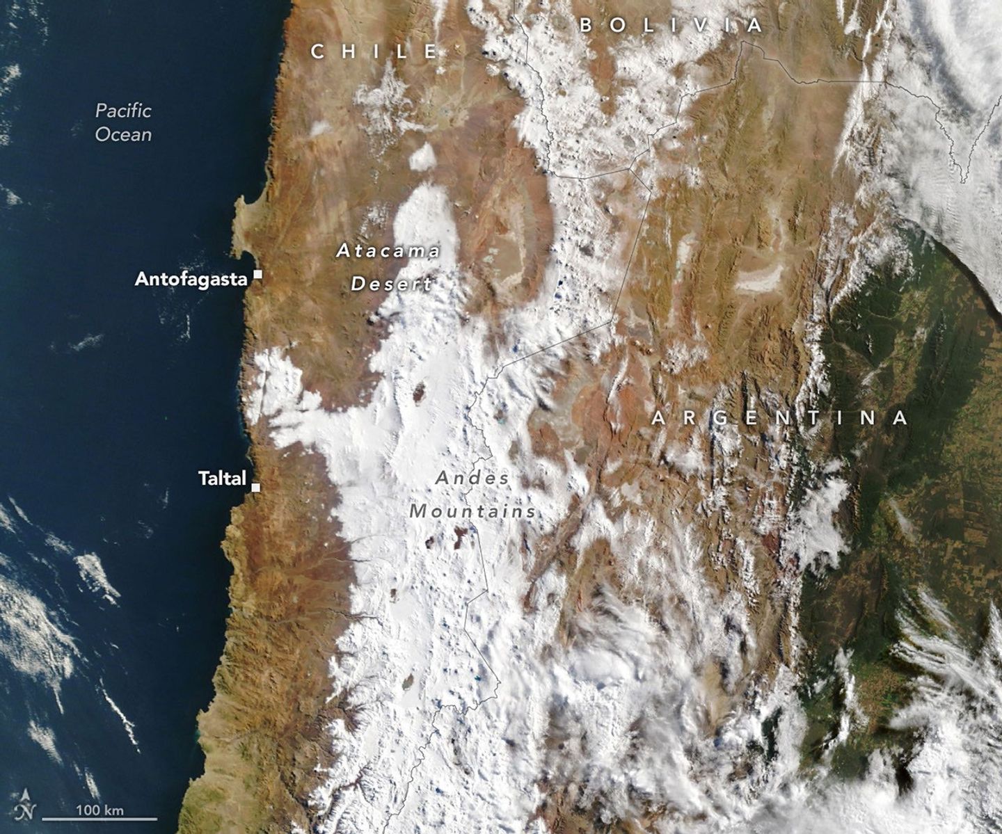 A wide view of northern Chile, Argentina, and southern Bolivia and Peru shows snow cover after a storm, stretching from the Andes into the core of the Atacama Desert. In one spot, a patch of snow reaches nearly to Chile's Pacific coast.