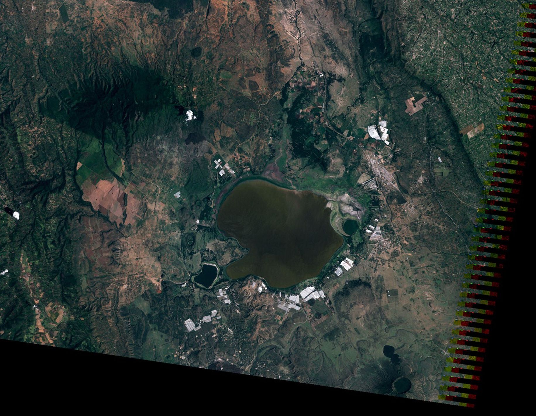 The first of a pair of satellite images shows Lake Naivasha with several communities surrounding it in 2010.