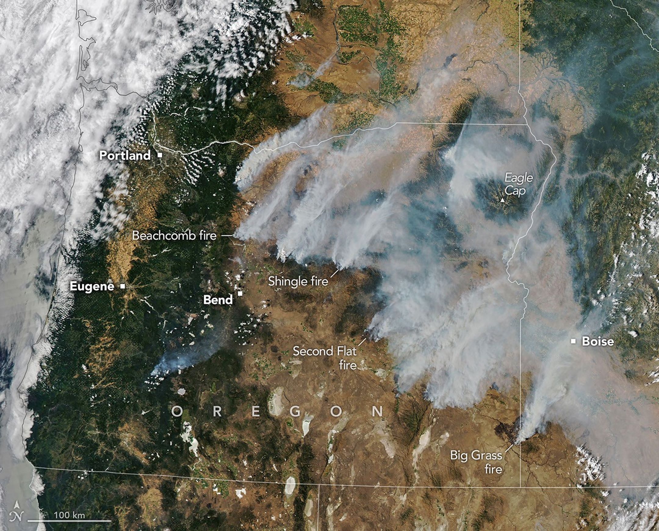 Long plumes of gray wildfire smoke stream northeast from a line of fires in central and eastern Oregon, including the Beachcomb, Shingle, and Second Flat fires that threatened communities.