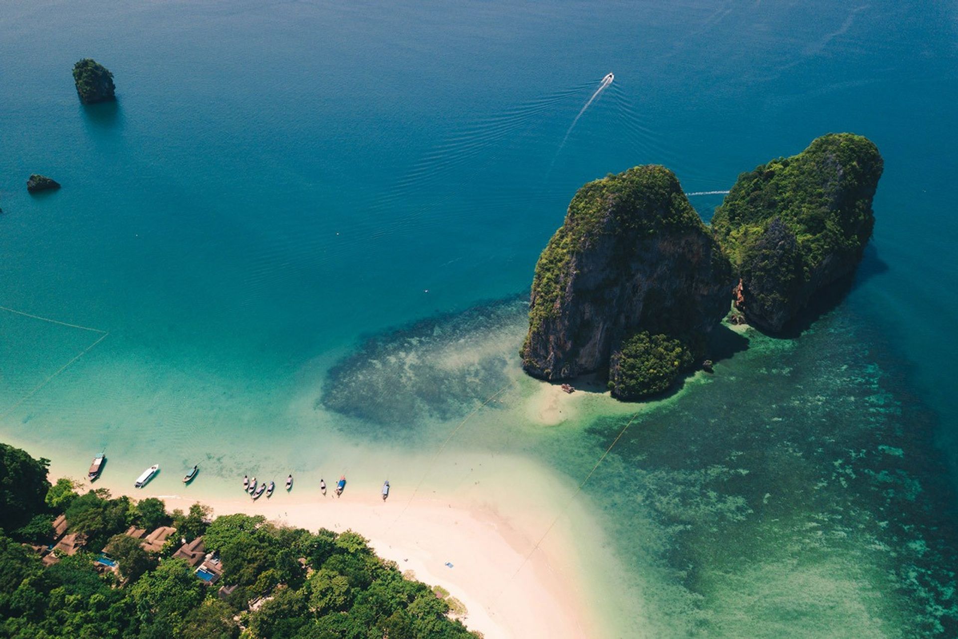 Aerial view of limestone towers protruding from seawater off the coast of Krabi Province, Thailand.