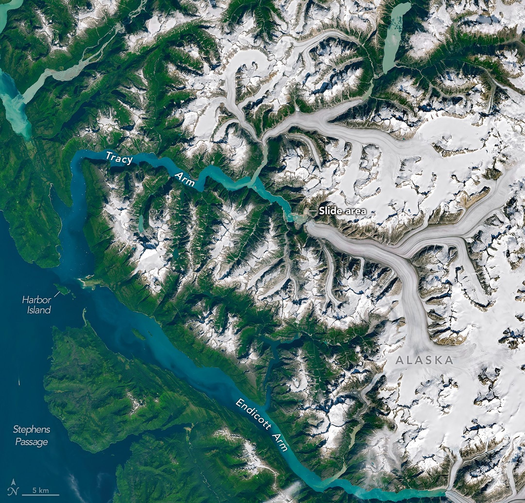 A satellite view shows Tracy Arm, centered, in context with other nearby waterways and glaciers in southeast Alaska.