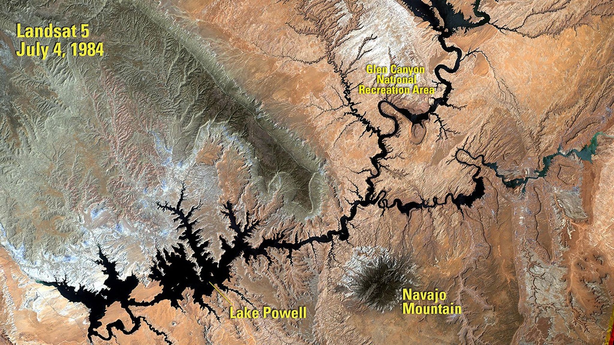 The 1984 image shows Lake Powell a year after its highest water level was recorded. The 2018 image was taken following a period of drought that began in 2000. When the water volume was measured five months later, it was less than half of what the lake can hold. Powell is a reservoir, formed in 1963 when the Glen Canyon Dam was built on the Colorado River. It resides mostly in Utah, with its southern end at the dam in northern Arizona. See also Drought in Lake Powell, Arizona and Utah.   The 1984 image was taken by Landsat 5. The 2018 image was taken by Landsat 8. Source: U.S. Geological Survey’s National Land Imaging Image Collections