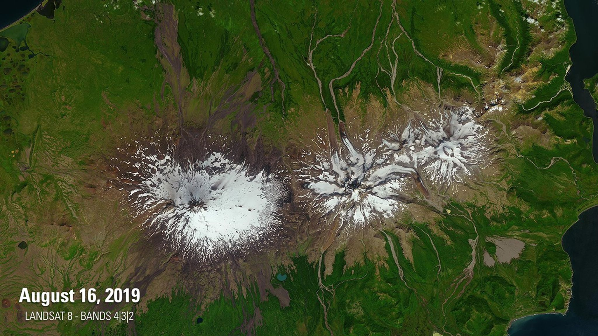 The 2019 image shows Mt. Shishaldin (left), a volcano on the eastern edge of Alaska's Aleutian Island chain, after a series of low-level eruptions that occurred the previous month. The 2020 image catches Shishaldin during a larger eruption that shot a plume of ash 5 miles (8 kilometers) into the sky. The bright yellow and red are false-color representations of what the satellite saw at infrared wavelengths. Images taken by Landsat 8. Source: U.S. Geological Survey’s National Land Imaging Image Collections