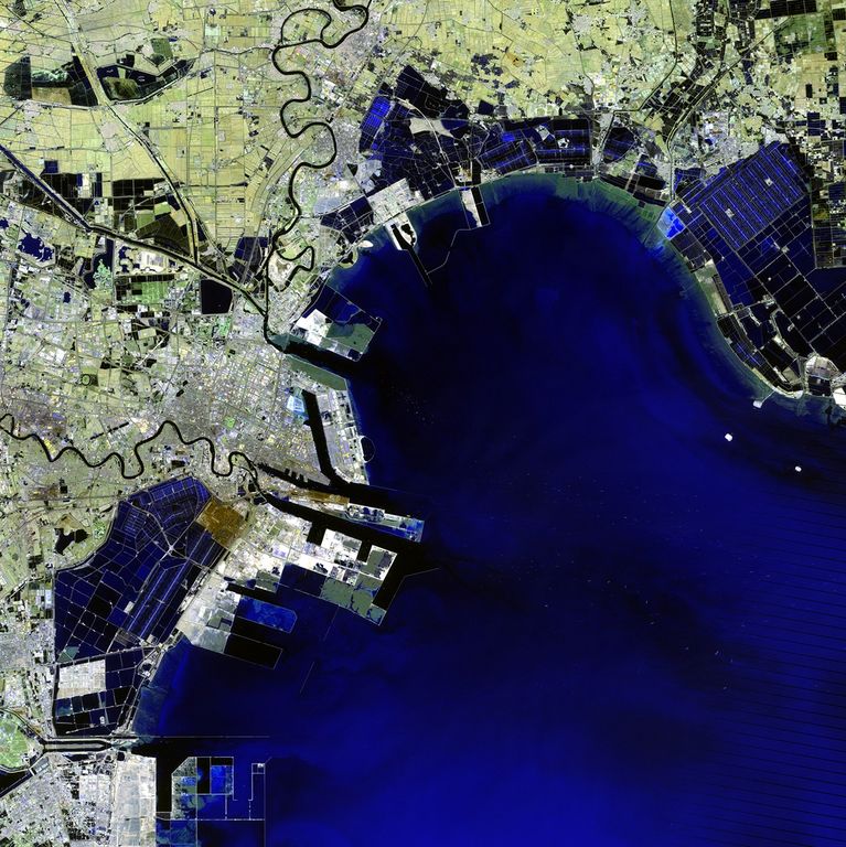 The Binhai New Area — once home to salt farms, reed marshes and wasteland — has grown into one of China's key economic hubs. Since development began in the 1990s, it has become the home of numerous aerospace, oil, chemical and other manufacturing industries. Plans for coming years include an international airport. The changes over 20 years can be seen in these images acquired in 1992 and 2012. The Binhai New Area is located on the coast of the Bohai Sea Region southeast of China's capital city, Beijing. 1992 image taken by the Thematic Mapper sensor onboard Landsat 5. 2012 image taken by the Enhanced Thematic Mapper Plus sensor onboard Landsat 7. Source: U.S. Geological Survey (USGS) Landsat Missions Gallery, "Binhai New Area, China," U.S. Department of the Interior / USGS.