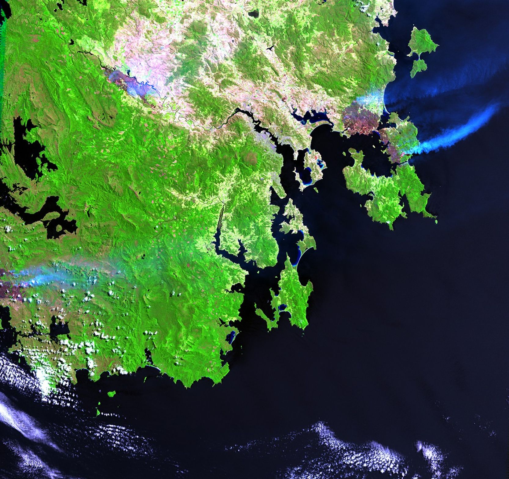 Extremely hot, dry weather in southern Australia has led to a number of brush fires. On the island of Tasmania, south of the Australian continent, more than 148,000 acres burned during the first half of January 2013. Losses reached $43 million and were predicted to exceed $100 million. In the township of Dunalley, over 40 percent of the structures have been destroyed. No deaths have been reported as of mid-January, but more than 100 people have been listed as missing. The 2012 image shows normal conditions; the 2013 image shows the burned areas and smoke rising from active fires in the upper right area. Images taken by the Enhanced Thematic Mapper Plus sensor onboard Landsat 7. Source: U.S. Geological Survey (USGS) Landsat Missions Gallery, "Brush Fires in Tasmania," U.S. Department of the Interior / USGS and NASA.