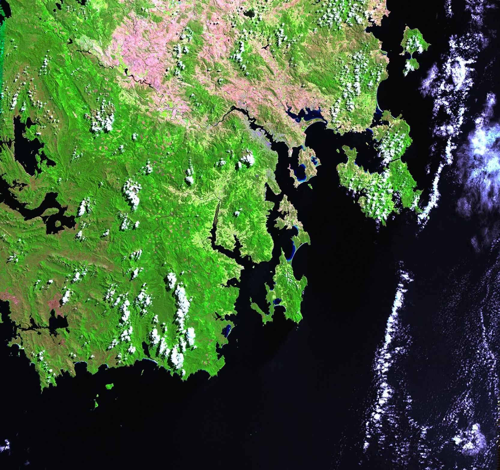Extremely hot, dry weather in southern Australia has led to a number of brush fires. On the island of Tasmania, south of the Australian continent, more than 148,000 acres burned during the first half of January 2013. Losses reached $43 million and were predicted to exceed $100 million. In the township of Dunalley, over 40 percent of the structures have been destroyed. No deaths have been reported as of mid-January, but more than 100 people have been listed as missing. The 2012 image shows normal conditions; the 2013 image shows the burned areas and smoke rising from active fires in the upper right area. Images taken by the Enhanced Thematic Mapper Plus sensor onboard Landsat 7. Source: U.S. Geological Survey (USGS) Landsat Missions Gallery, "Brush Fires in Tasmania," U.S. Department of the Interior / USGS and NASA.