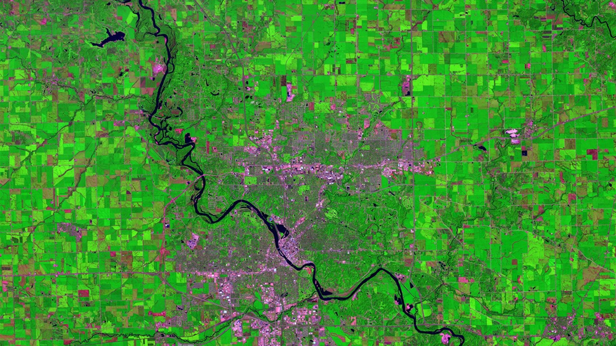 Storms that dropped some 10 inches of rain swelled the Cedar River to 6 feet above its major flood-stage designation at Cedar Rapids, Iowa, on September 27, 2016. Authorities advised some 10,000 residents to evacuate. In these images, the countryside appears green during the growing season (July) and magenta when the crops were ready for harvest (September). Images taken by the Operational Land Imager onboard Landsat 8. Source: U.S. Geological Survey (USGS) Landsat Missions Gallery; U.S. Department of the Interior / USGS and NASA.