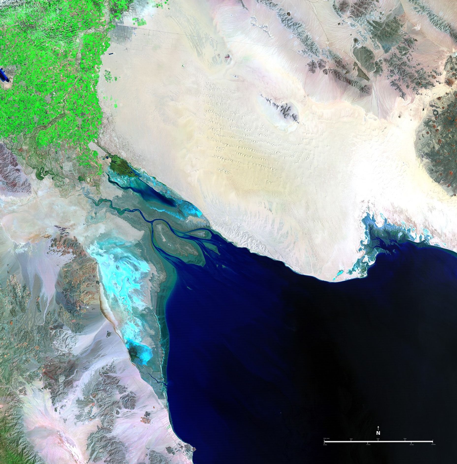 These two pictures illustrate the extremes of water flow in the Colorado River since measurements began in the late 1800s. The 1985 image was taken in the midst of record high flow, while the 2007 image shows the driest period. Excessive rains or severe droughts directly change the amount of water available in the Colorado River Basin, and so does the increasing pressure of human needs throughout the western states. The river, which has its headwaters in the snowmelt of the Rocky Mountains, is 1,400 miles (2,253 kilometers) long and empties into the Gulf of California, also known as the Sea of Cortez. It provides water for drinking, irrigation, electricity, industry, and recreation for seven U.S. and two Mexican states, serving more than 25 million people.   Images taken by the Thematic Mapper sensor onboard Landsat 5. Source: U.S. Geological Survey (USGS) Landsat Missions Gallery, "Colorado River into the Gulf of California," U.S. Department of the Interior / USGS and NASA.