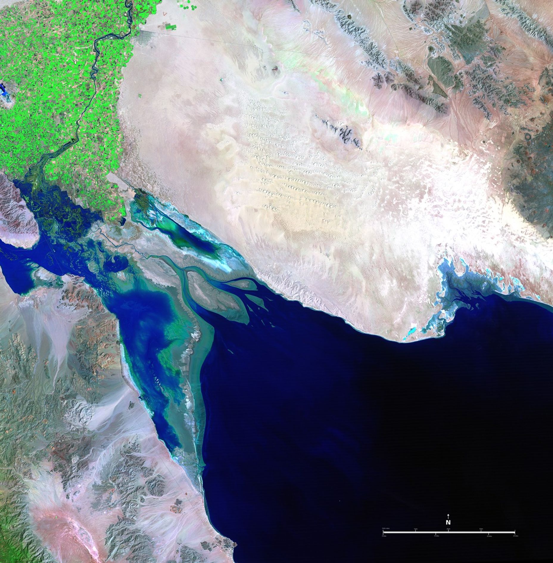 These two pictures illustrate the extremes of water flow in the Colorado River since measurements began in the late 1800s. The 1985 image was taken in the midst of record high flow, while the 2007 image shows the driest period. Excessive rains or severe droughts directly change the amount of water available in the Colorado River Basin, and so does the increasing pressure of human needs throughout the western states. The river, which has its headwaters in the snowmelt of the Rocky Mountains, is 1,400 miles (2,253 kilometers) long and empties into the Gulf of California, also known as the Sea of Cortez. It provides water for drinking, irrigation, electricity, industry, and recreation for seven U.S. and two Mexican states, serving more than 25 million people.   Images taken by the Thematic Mapper sensor onboard Landsat 5. Source: U.S. Geological Survey (USGS) Landsat Missions Gallery, "Colorado River into the Gulf of California," U.S. Department of the Interior / USGS and NASA.