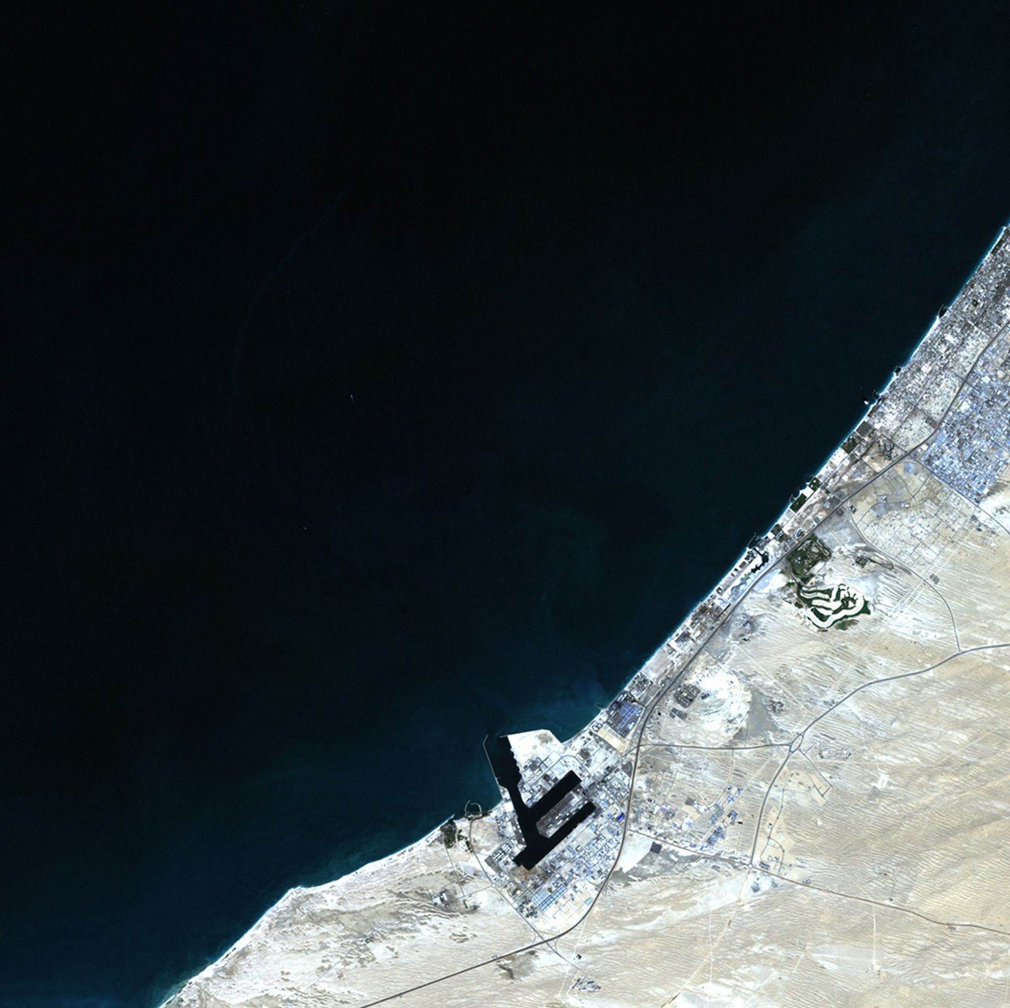 The city of Dubai is situated along the Persian Gulf in the United Arab Emirates. In 2001, work began to create artificial archipelagos along Dubai's shoreline. The results are visible in the 2012 image: Palm Jebel Ali, the smaller Palm Jumeirah and, north of the two "palm islands," a group of smaller islands known as "The World" because they are roughly in the shape of a world map. The World provides an additional 144 miles of shoreline.   Images taken by the Enhanced Thematic Mapper Plus sensor onboard Landsat 7. Source: U.S. Geological Survey (USGS) Landsat Missions Gallery “Dubai’s Islands,” U.S. Department of the Interior / USGS and NASA.