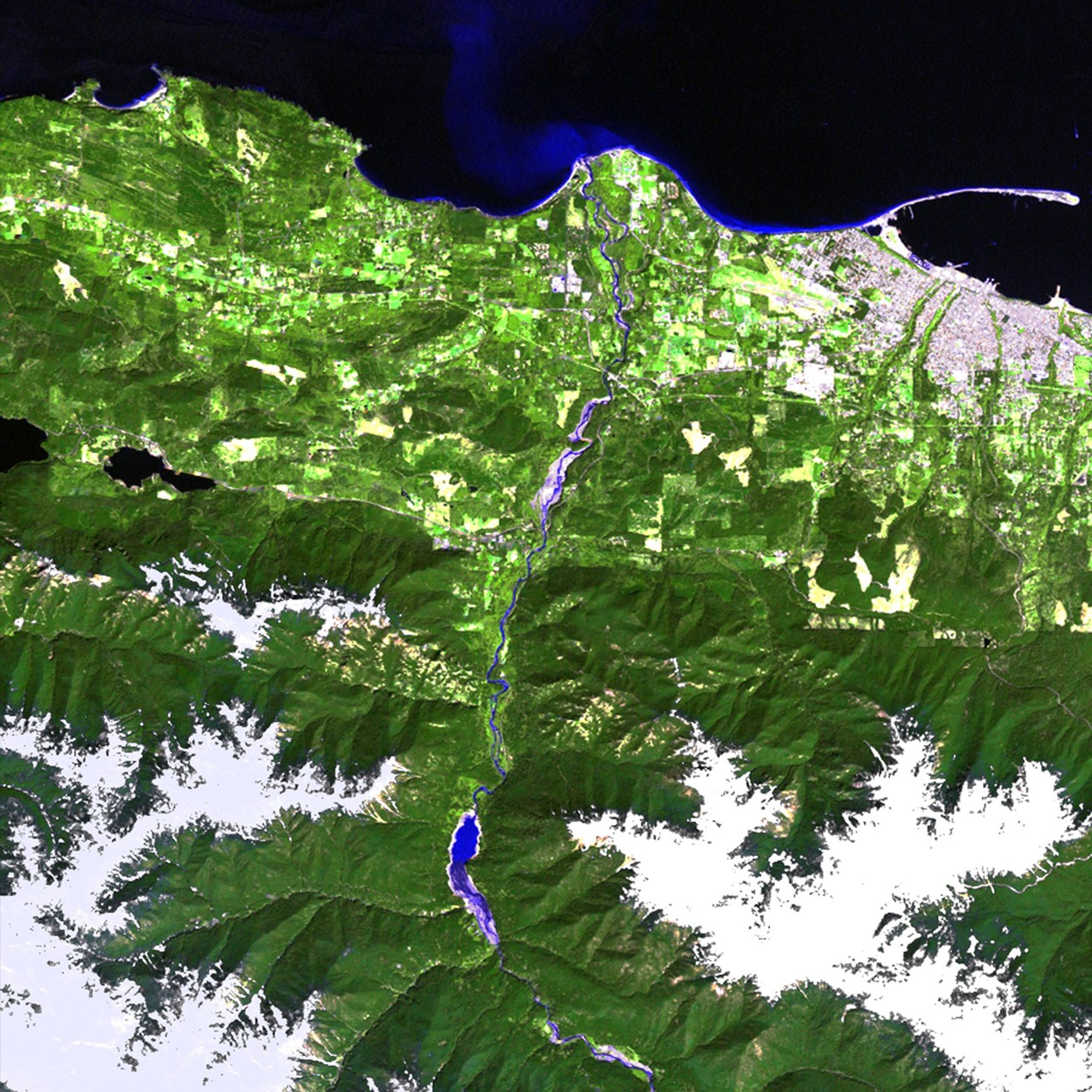 The Elwha and Glines Canyon dams were built in the 1920s to provide hydroelectric power. But the machinery became outdated over the decades and the reservoirs grew heavily silted. Further, the dams prevented salmon from reaching upstream habitat. The Elwha dam was removed in early 2012 and these images show the results in the Elwha River basin of the Washington State Olympic Peninsula. In the 2012 image, the reservoir behind the dam is gone, the exposed silt deposits are gradually diminishing, and natural river flow is returning. The Glines Canyon dam is scheduled for removal by late 2013. Images taken by the Thematic Mapper sensor onboard Landsat 5 and the Enhanced Thematic Mapper Plus onboard Landsat 7. Source: U.S. Geological Survey (USGS) Landsat Missions Gallery, "Elwha River restoration," U.S. Department of the Interior / USGS and NASA.
