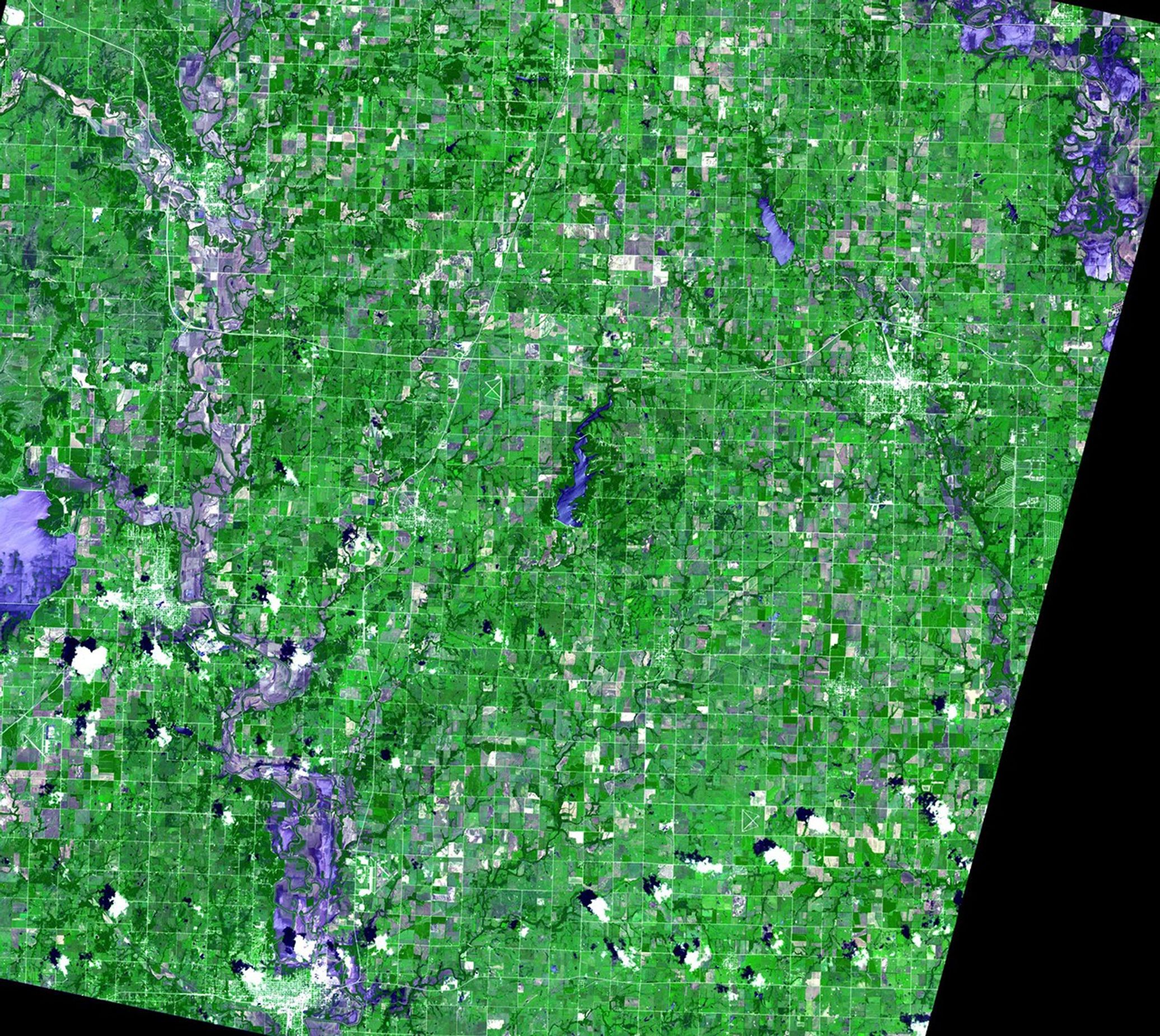 At the beginning of July 2007, Kansas and Missouri were hit hard by days of heavy rain and resulting flooding. The Neosho River (upper right corner of images) and Verdigris River (running north-south across the left side of the pictures) in Kansas rose to record levels, flooding the towns of Independence and Coffeyville. Images taken by the Advanced Spaceborne Thermal Emission and Reflection Radiometer (ASTER), courtesy of NASA/GSFC/METI/Japan Space Systems and the U.S./Japan ASTER Science Team. Source: ASTER Gallery.