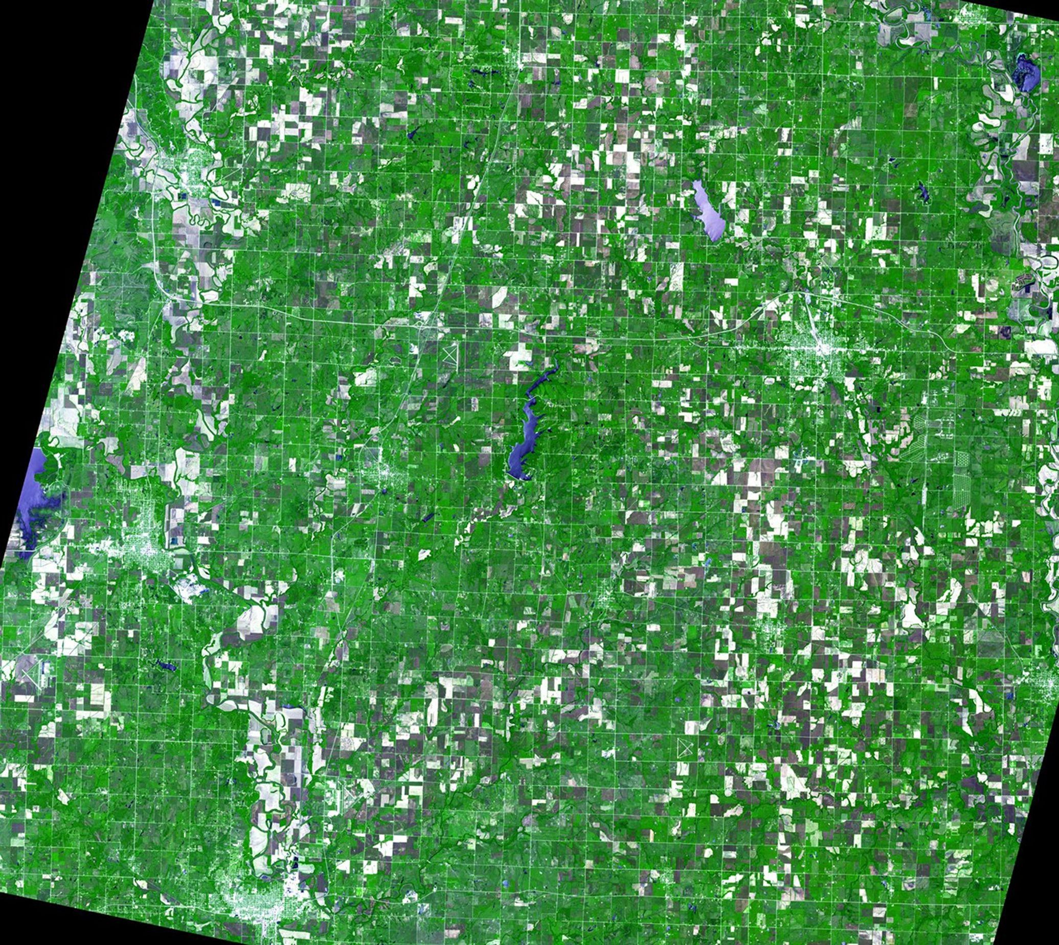 At the beginning of July 2007, Kansas and Missouri were hit hard by days of heavy rain and resulting flooding. The Neosho River (upper right corner of images) and Verdigris River (running north-south across the left side of the pictures) in Kansas rose to record levels, flooding the towns of Independence and Coffeyville. Images taken by the Advanced Spaceborne Thermal Emission and Reflection Radiometer (ASTER), courtesy of NASA/GSFC/METI/Japan Space Systems and the U.S./Japan ASTER Science Team. Source: ASTER Gallery.