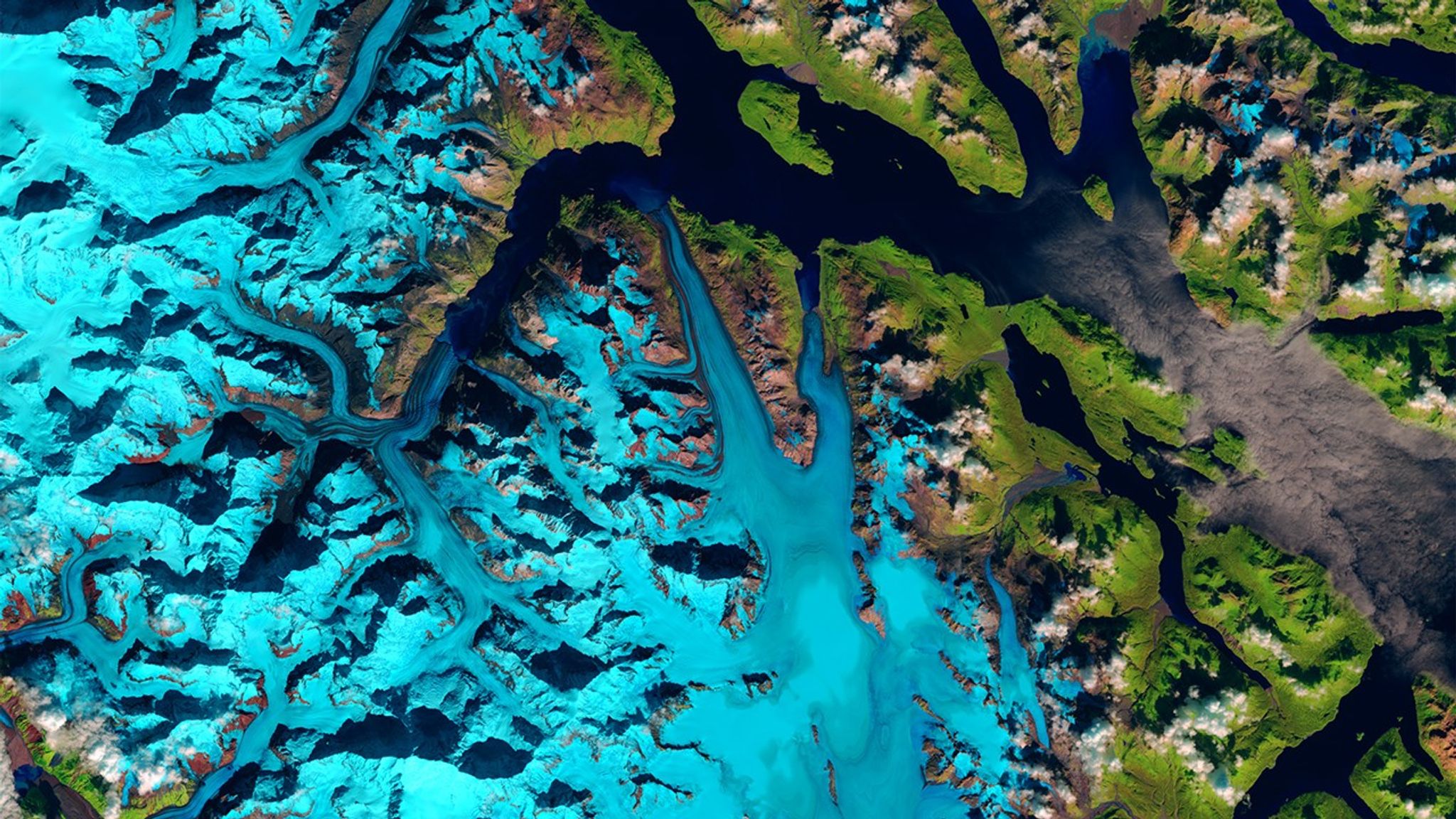 On June 28, 2016, a 4,000-foot-high mountainside in Glacier Bay National Park and Preserve collapsed, dropping rocky debris equivalent to 60 million mid-size SUVs onto nearby Lamplugh Glacier. Seismologists estimated that the material tumbled down the mountain for nearly one minute and then continued to slide along the glacier for another 6 miles. The southeast corner of Alaska, where this event took place, is geologically active and considered a hotspot for such landslides.   Images taken by the Operational Land Imager onboard Landsat 8. Source: U.S. Geological Survey (USGS) Landsat Missions Gallery; U.S. Department of the Interior / USGS and NASA.